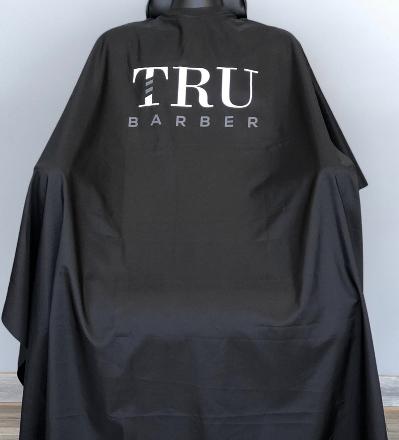 TRUBARBER PROFESSIONAL BARBER CAPE – Black With White Letters